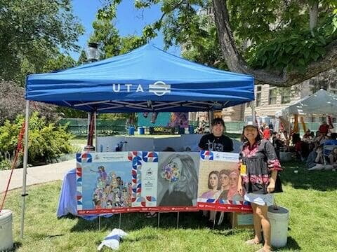 Charis at a Utah Transit Authority (UTA) community engagement stand.,