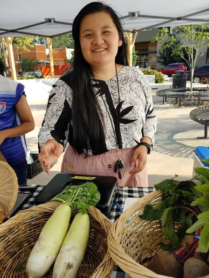 Ehler at a farmers market stand. 