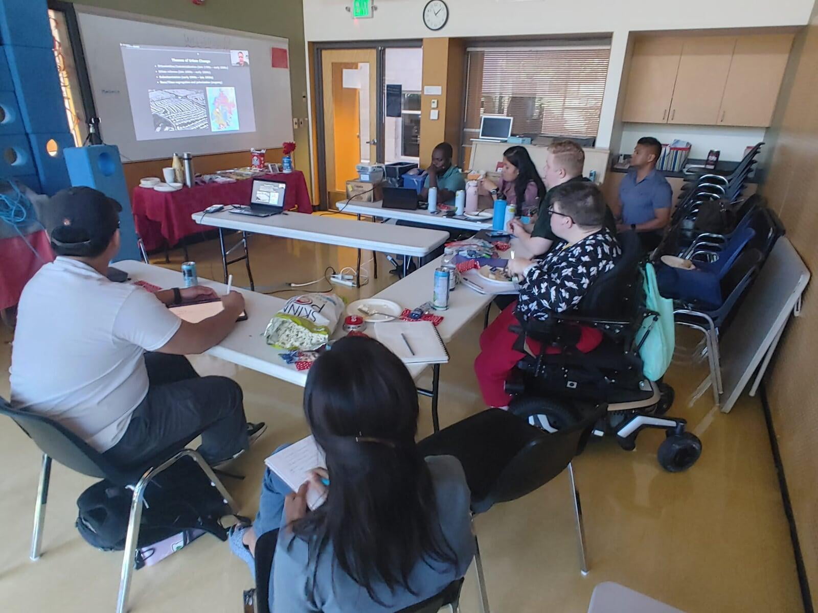 Talitha team watching a live lecture by Dr. Mark Pendras. 