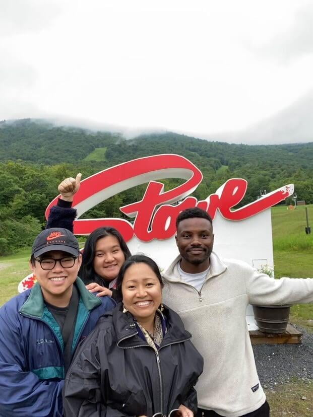 Shawn, Ehler, Charis, and Mo, at a "Stove" sign in Vermont. 
